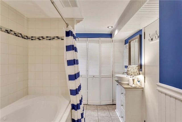 bathroom featuring radiator, shower / bath combo with shower curtain, vanity, and tile patterned flooring