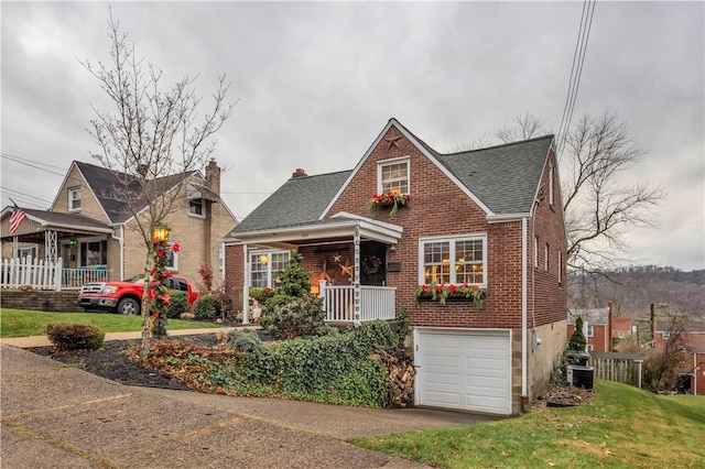 view of front facade with a garage and a front lawn