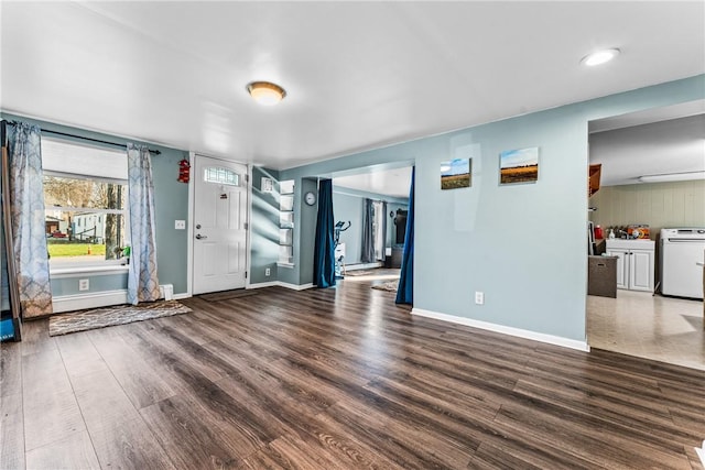 interior space featuring dark hardwood / wood-style floors and washer / dryer