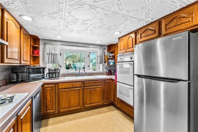 303 Water St, Jamestown, PA 16134 - kitchen featuring appliances with stainless steel finishes, an ornate ceiling, brown cabinets, open shelves, and light countertops