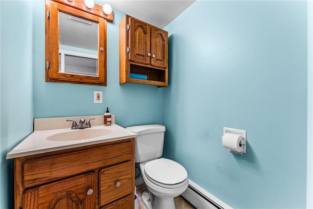 bathroom featuring vanity, a baseboard radiator, and toilet