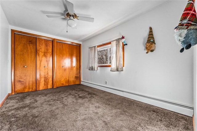 303 Water St, Jamestown, PA 16134 - unfurnished bedroom featuring a baseboard heating unit, dark colored carpet, and ceiling fan
