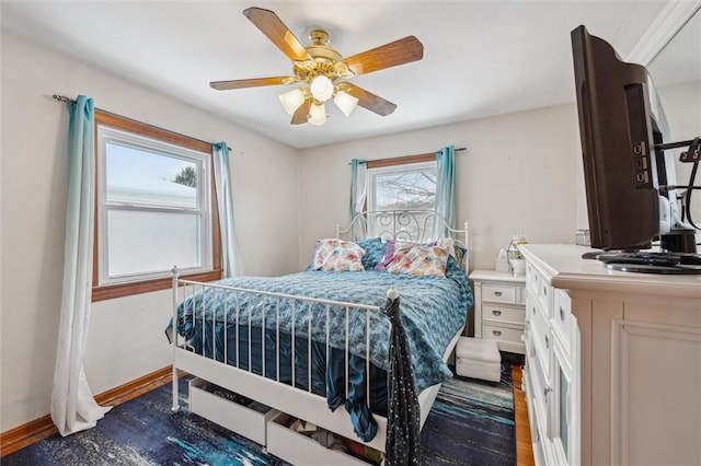 bedroom featuring ceiling fan and dark wood-type flooring