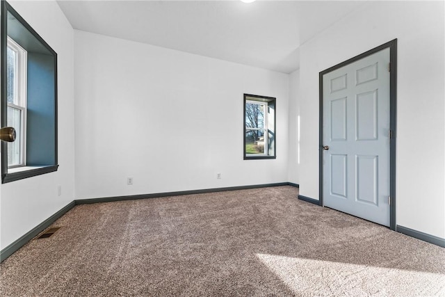 unfurnished bedroom with carpet flooring