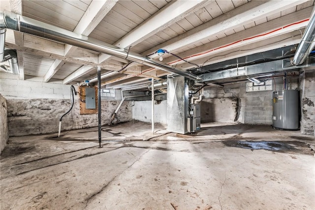 basement with heating unit, electric panel, and water heater