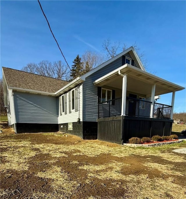 view of property exterior with covered porch