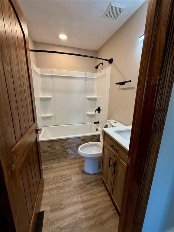 full bathroom featuring shower / bath combination, vanity, toilet, and wood-type flooring