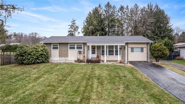 ranch-style house with a front lawn