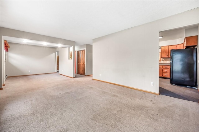 unfurnished living room with light carpet