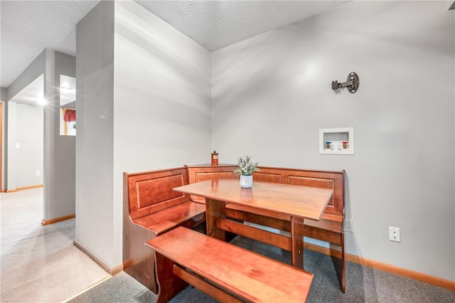 dining area with a textured ceiling