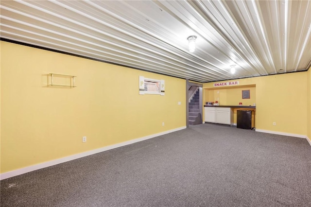 basement with black fridge