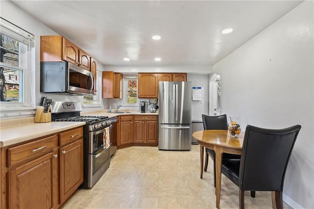 kitchen featuring stainless steel appliances and sink