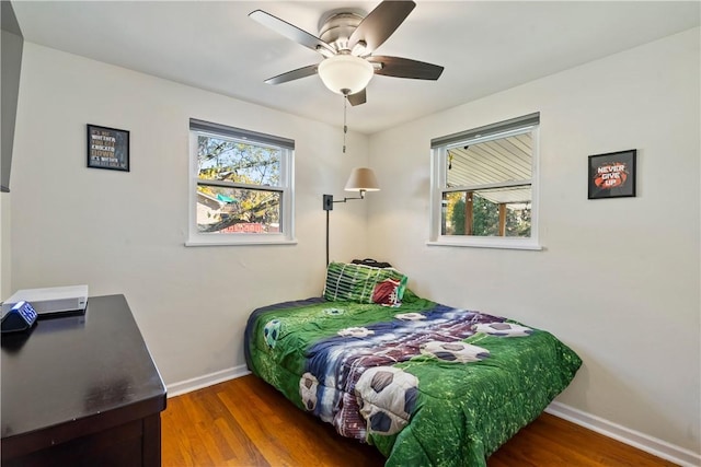 bedroom featuring ceiling fan and hardwood / wood-style flooring