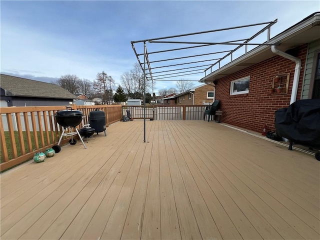 wooden terrace with area for grilling