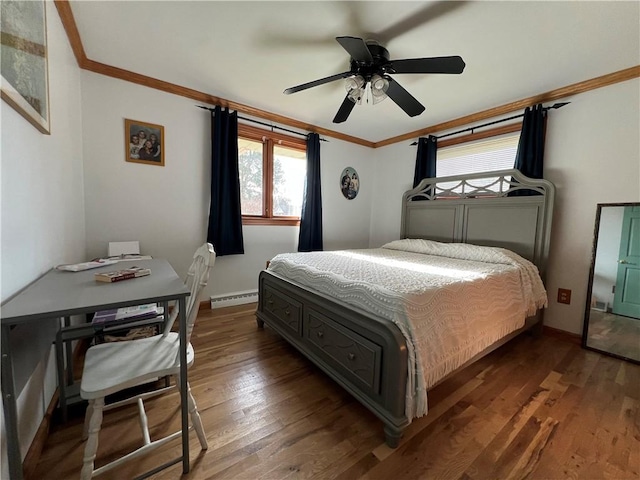 bedroom with ornamental molding, dark hardwood / wood-style flooring, ceiling fan, and a baseboard heating unit