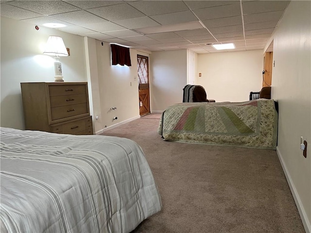 bedroom with carpet and a drop ceiling