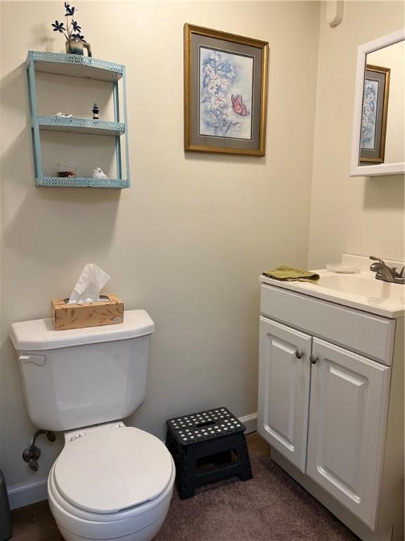 bathroom featuring vanity and toilet