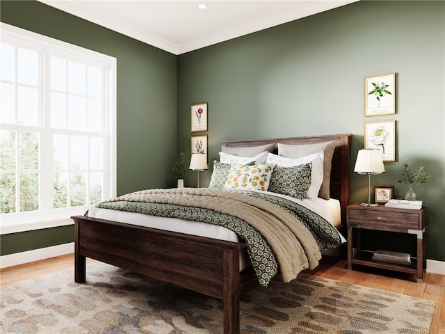 bedroom featuring wood-type flooring and ornamental molding