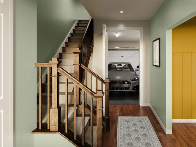 staircase featuring wood-type flooring