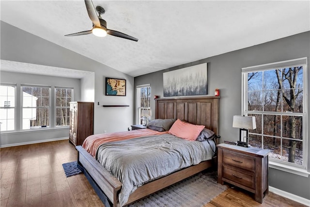 bedroom with ceiling fan, lofted ceiling, and hardwood / wood-style flooring