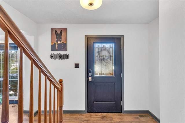 foyer entrance featuring hardwood / wood-style flooring