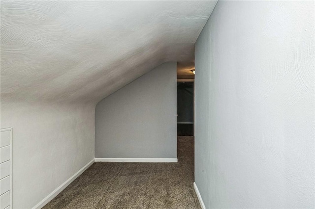 bonus room featuring carpet flooring and lofted ceiling