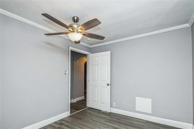 unfurnished room featuring dark hardwood / wood-style floors and crown molding