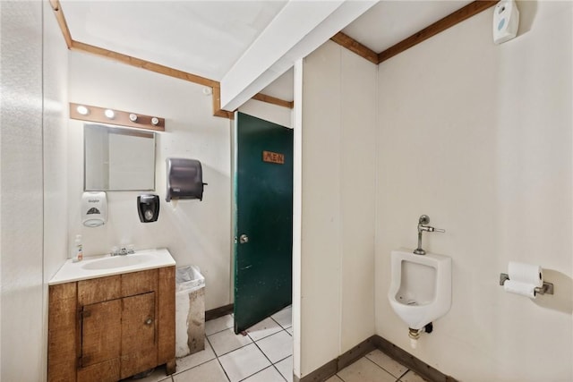 bathroom featuring tile patterned flooring and vanity