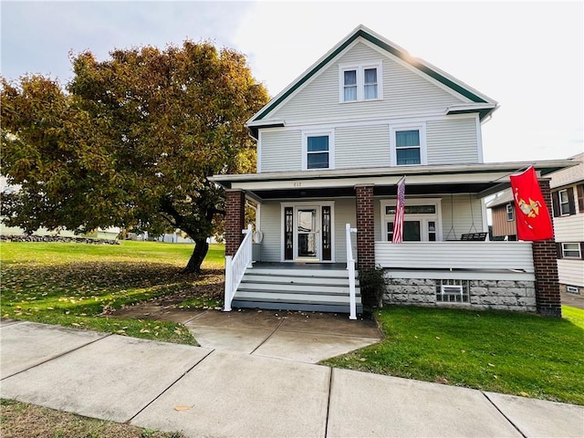 view of front facade featuring a porch and a front lawn