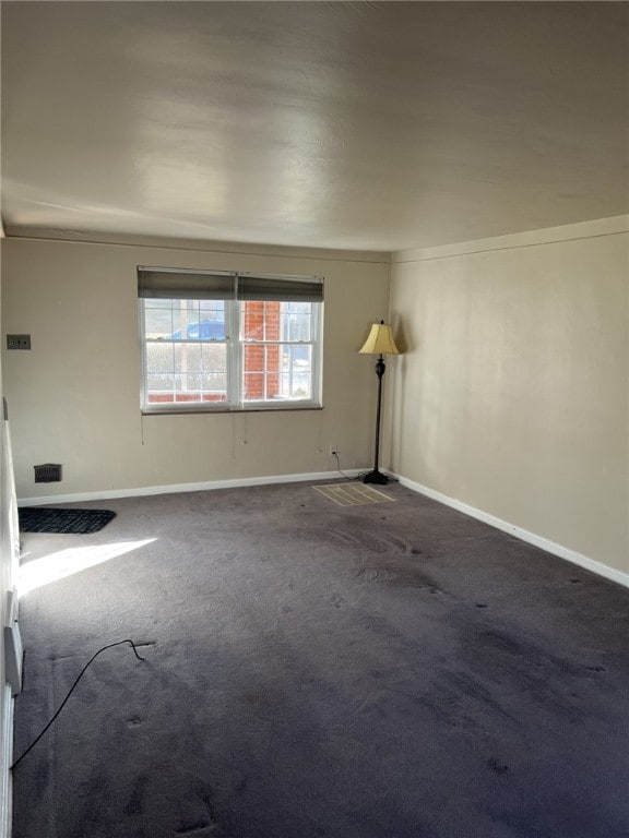 carpeted empty room with ornamental molding