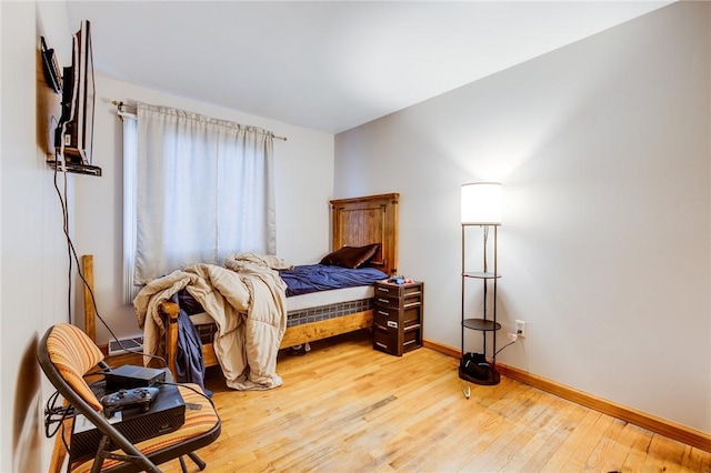 bedroom with light hardwood / wood-style flooring