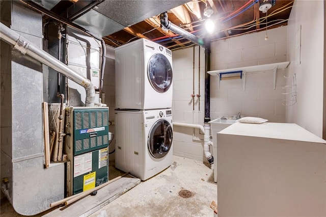 laundry area with stacked washer / dryer