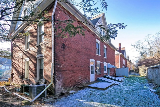 view of side of property with cooling unit