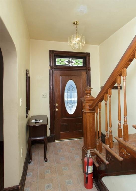 foyer entrance with an inviting chandelier