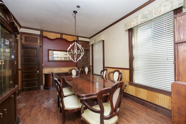 dining area with a notable chandelier, ornamental molding, dark wood-type flooring, and wooden walls