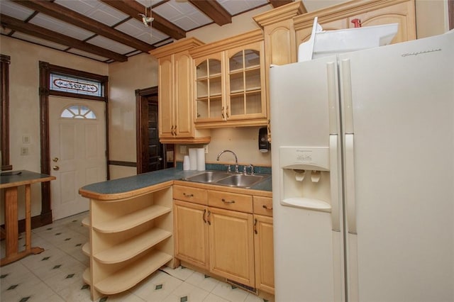 kitchen with light brown cabinets, sink, white fridge with ice dispenser, beamed ceiling, and light tile patterned flooring