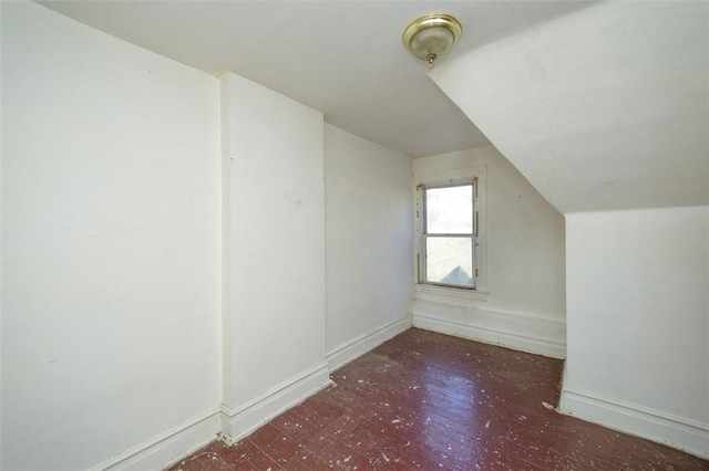 additional living space with vaulted ceiling