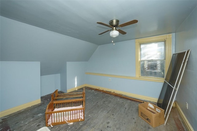 additional living space with dark hardwood / wood-style flooring, ceiling fan, and lofted ceiling