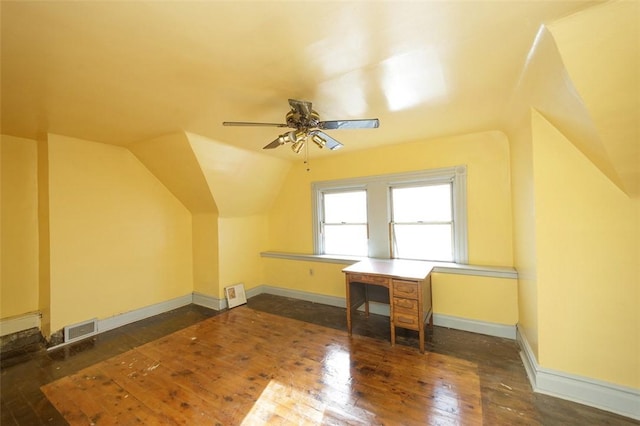 bonus room with ceiling fan, dark hardwood / wood-style flooring, and lofted ceiling