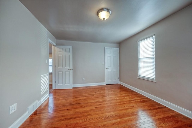 unfurnished room featuring light wood-type flooring