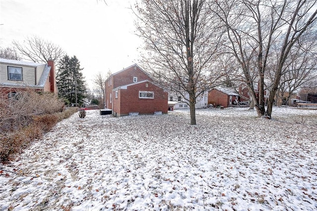 view of yard covered in snow