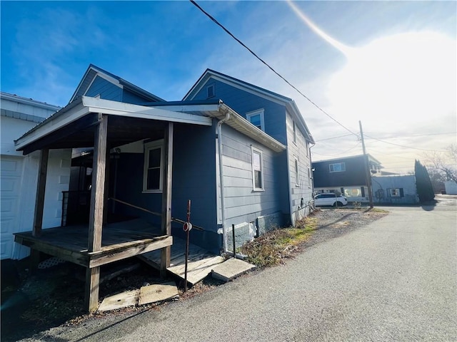 view of side of home featuring a garage