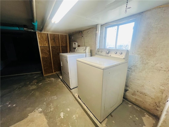 clothes washing area with independent washer and dryer