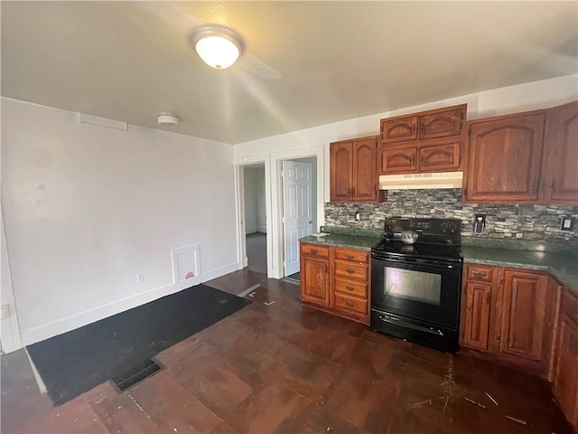 kitchen featuring decorative backsplash and electric range