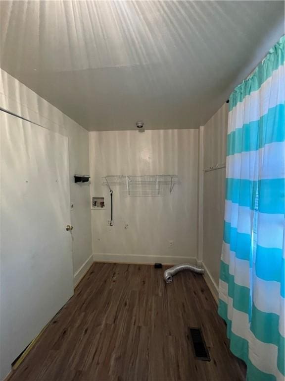 laundry room featuring dark wood-type flooring