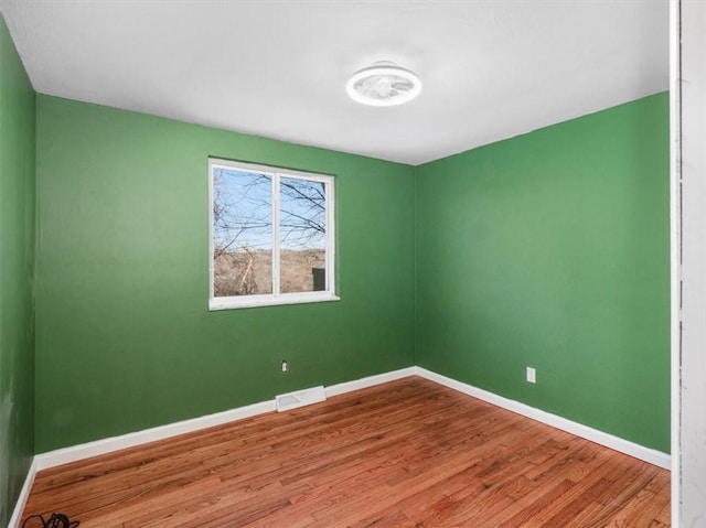 unfurnished room featuring wood-type flooring