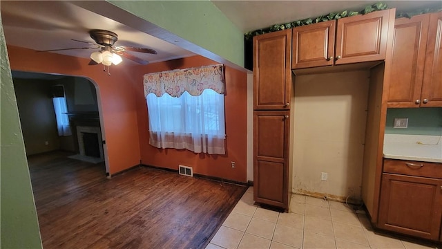 kitchen with light hardwood / wood-style floors and ceiling fan