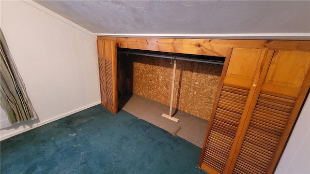 interior details featuring carpet floors and wooden walls