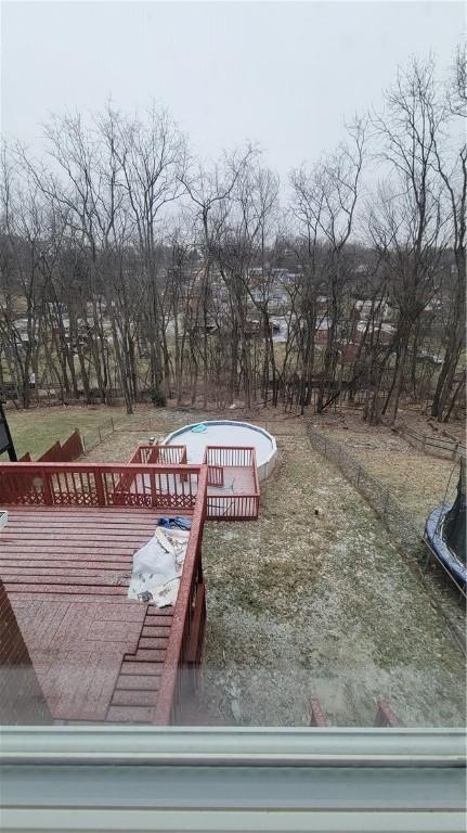 wooden deck featuring a trampoline