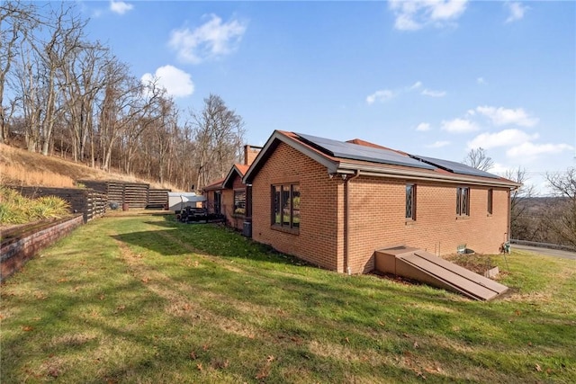 view of property exterior featuring a lawn